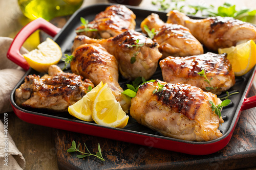 Grilled chicken thighs and drumsticks with honey glaze photo
