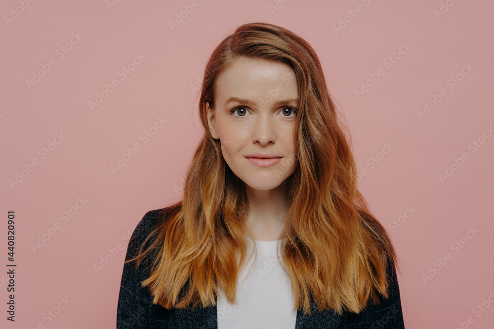 Obraz premium Close up of young confident woman posing in studio