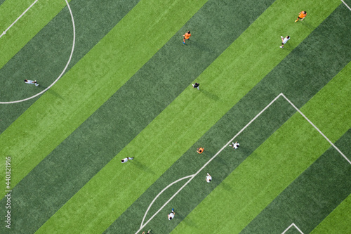 Aerial top view of athletes on football field