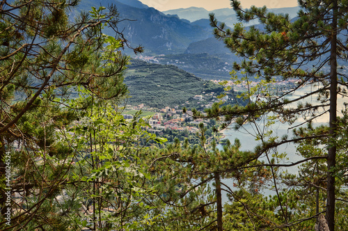 Monte Rocchetta - morning view from above to town Riva del Garda, mountains, forest, monte brione photo