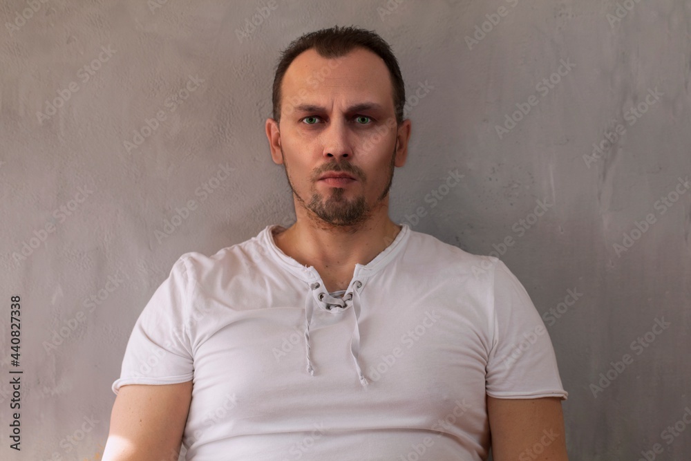 portrait of a brutal man with a stern look