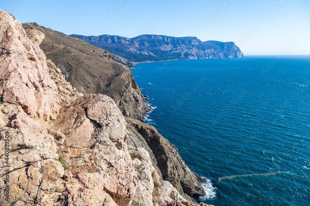 Scenic panoramic view of Balaclava bay with yachts from the ruines of Genoese fortress Chembalo. Balaklava, Sevastopol, Crimea. Inspirational travel landscape. Aerial photo.