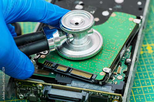 hard drive diagnostics with a stethoscope. Recovery, search lost data, information in hdd repair service