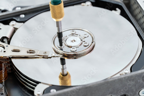 hard disk drive disassembling process with screwdriver in information recovery, repair HDD service
