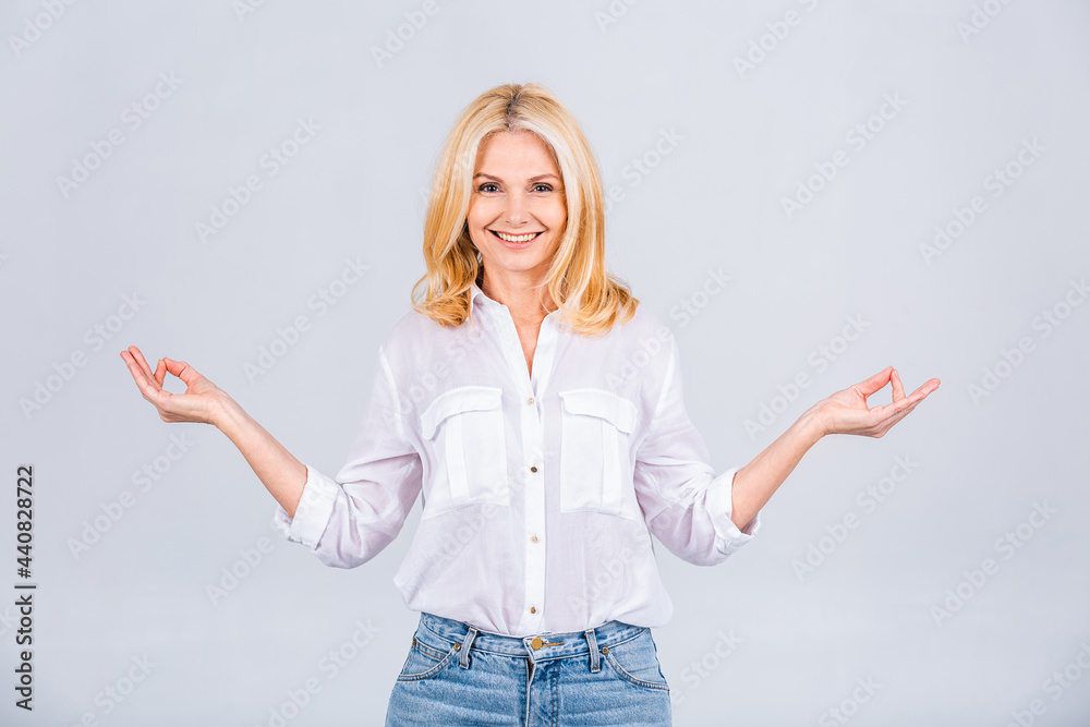 Just relax! Photo of happy positive good mood dreamy woman doing yoga meditating relaxing isolated on grey or white color background. Just relax! Photo of happy positive good mood dreamy woman doing yoga meditating relaxing isolated on grey or white color background.