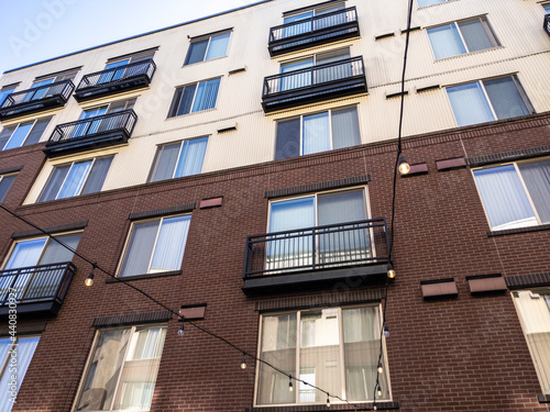view of a Seattle apartment building, with strings of lights hung up below
