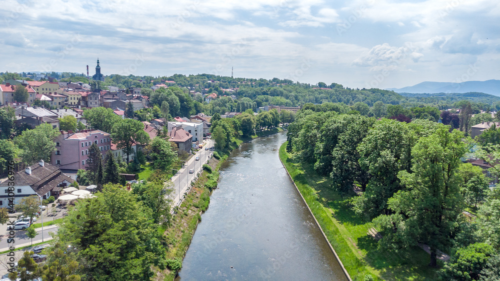Fototapeta premium Olza river on a border between Poland and Czech Republic. View from bird sight. City from drone.