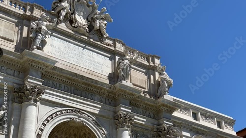 The facade of the Trevi Fountain in Rome with the Ocean Statue in the central niche photo