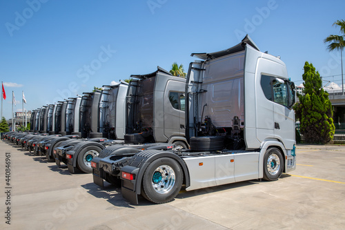 New heavy trucks in truck store, trucks lined up 