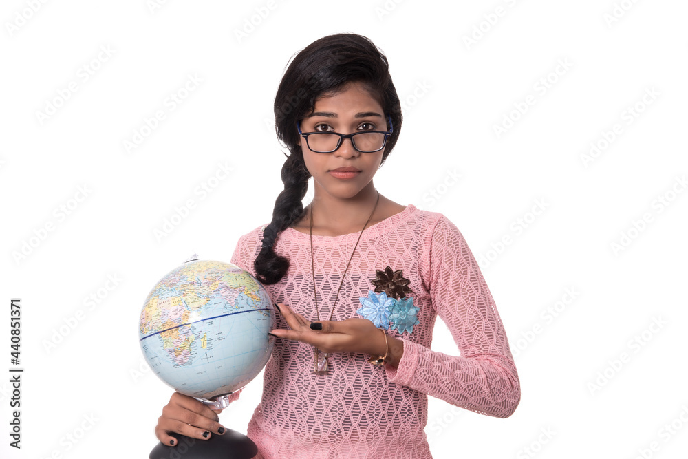 Beautiful Girl holding a world globe isolated on a white background Beautiful Girl holding a world globe isolated on a white background