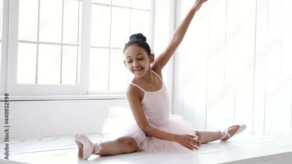 African Amercan little girl at ballet class in studio African Amercan little girl at ballet class in studio