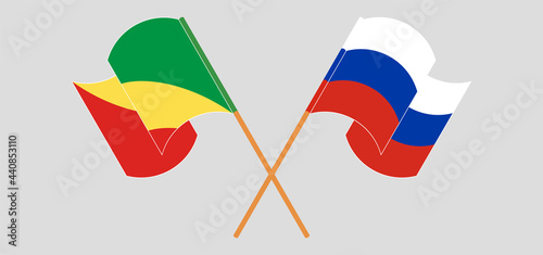 Crossed and waving flags of Republic of the Congo and Russia
