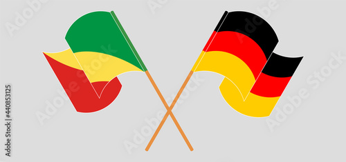Crossed and waving flags of Singapore and Germany