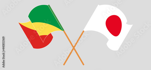 Crossed and waving flags of Republic of the Congo and Japan