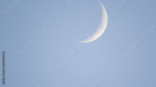 The moon against the blue sky