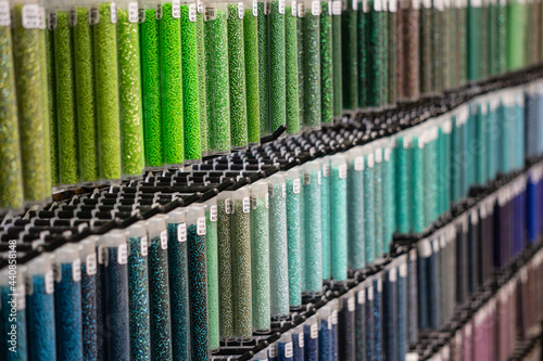 Colorful long containers of seed beads