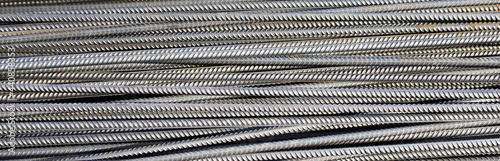 Pile of reinforcing steel bars as an abstract industrial background