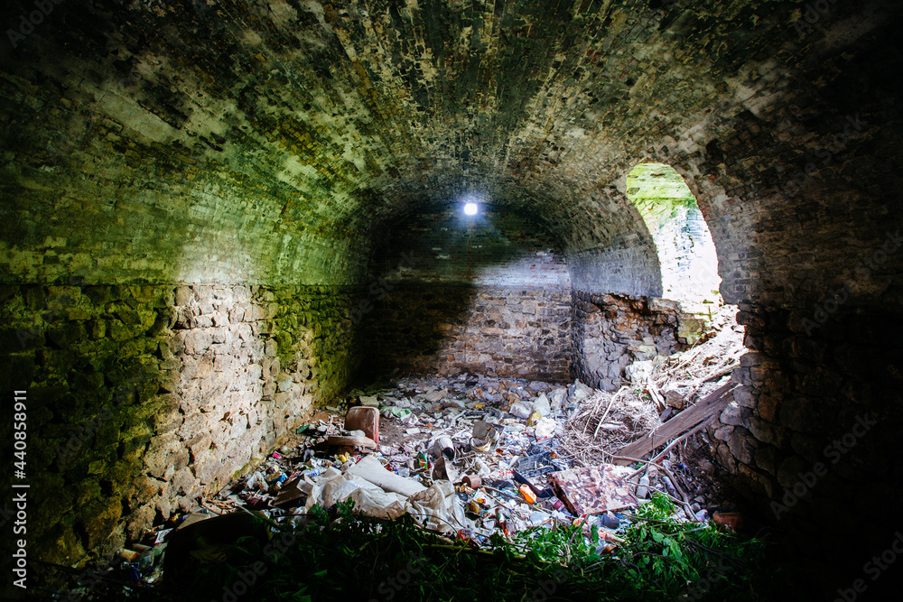 Abandoned empty old dark underground vaulted cellar