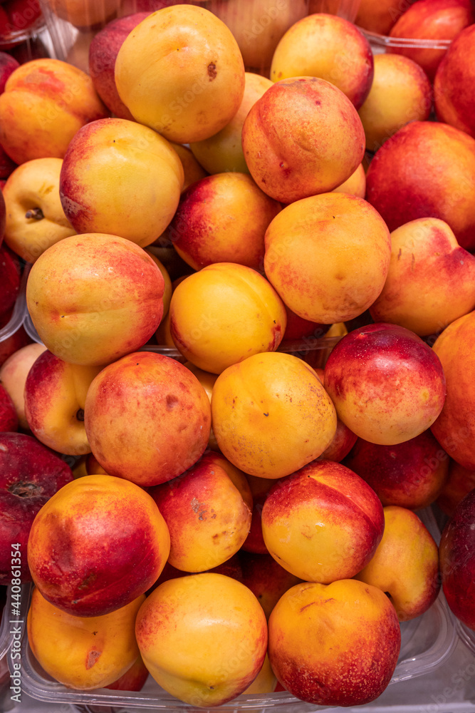 Fresh ripe peaches on the store counter