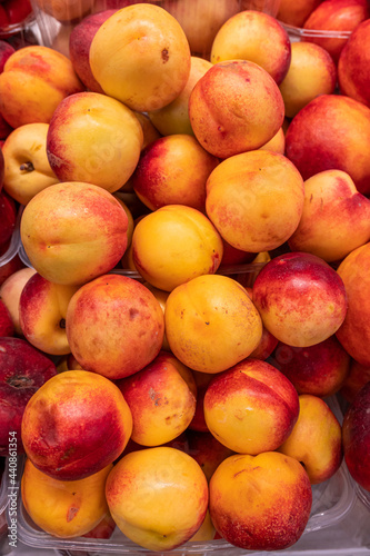 Fresh ripe peaches on the store counter