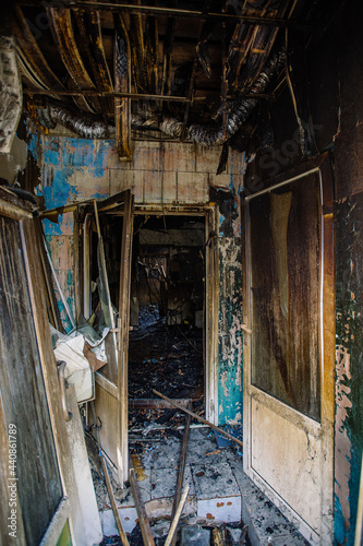Burnt out shop after fire with charred door