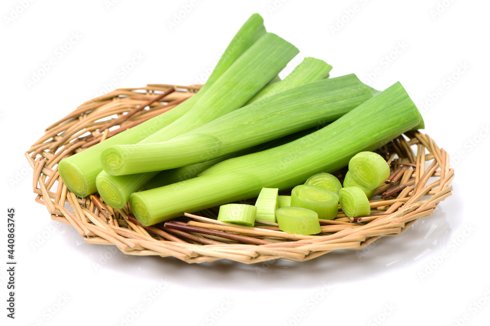 young green garlic leaves isolated on white background young green garlic leaves isolated on white background