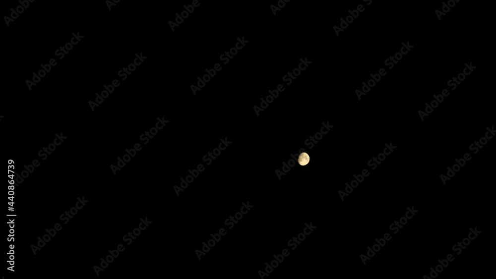 Timelapse. Moon movement in the dark sky. Moon at night. Timelapse. Moon movement in the dark sky. Moon at night.