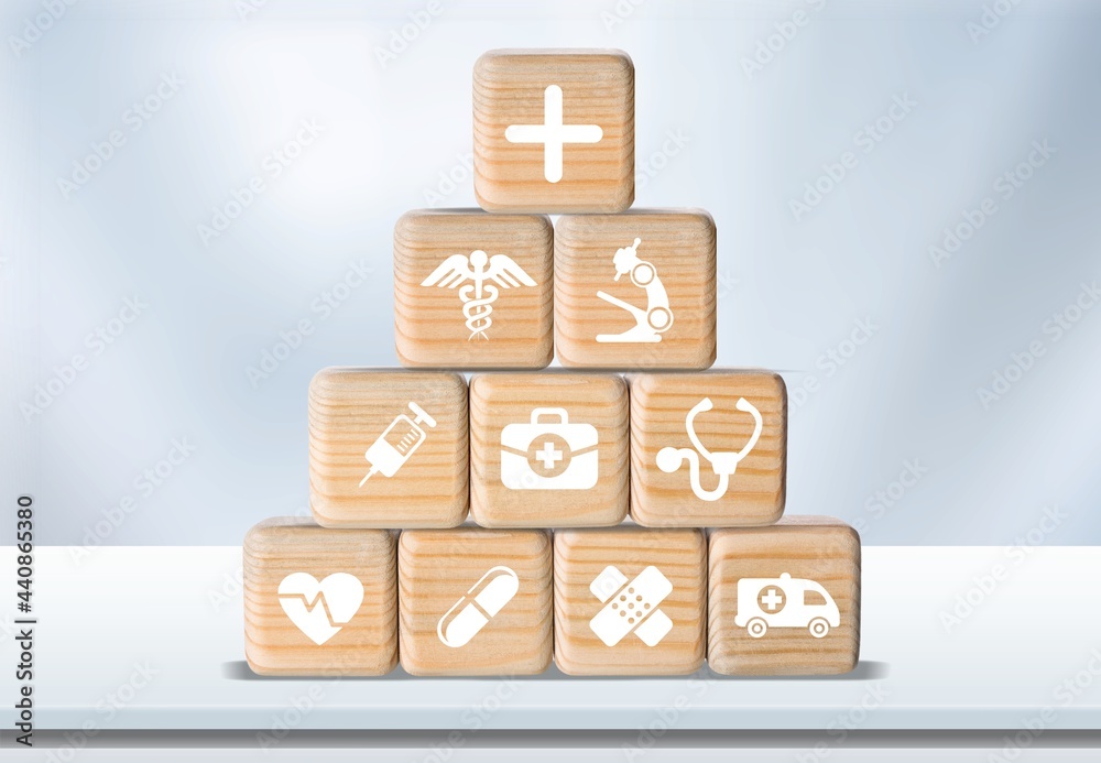 Medical health care wood block with icons on the desk
