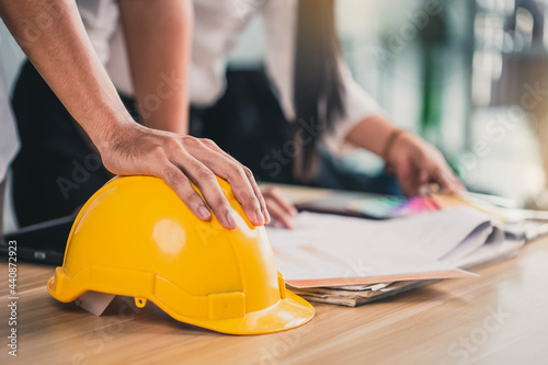 Meeting of engineer constuction and interior team dissussing in the office. Team of engineers working together in a architect office.- Architectural Concept.  Constuction Concept.