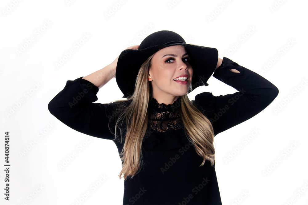 blonde woman wearing black outfit on white background with hat blonde woman wearing black outfit on white background with hat