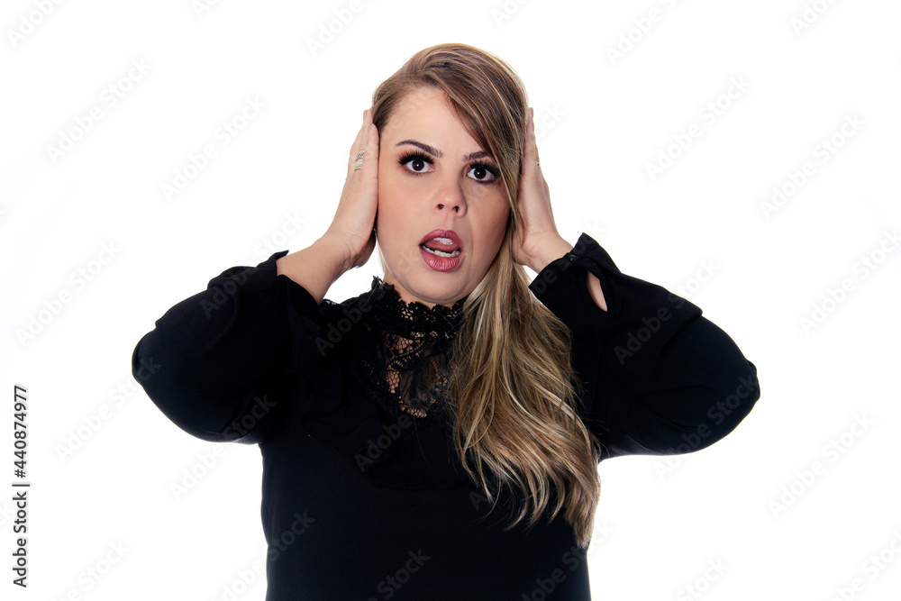 blonde woman covering the ears wearing black outfit on white background blonde woman covering the ears wearing black outfit on white background