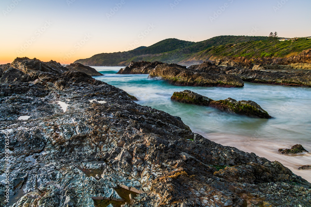 Sunrise seascape and a rocky beach