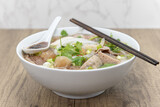 Hearty bowl of Pho loaded with meat, broth, and special taro sauce for a complete meal