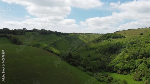 Devils Dyke, South Downs National Park, Sussex England. 4k Drone footage featuring paragliders and Poynings village at the foot of the downs photo