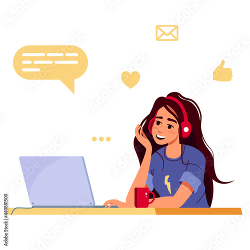 Modern young woman uses a laptop when working, studying, blogging, communication or programming. Work from home, freelancer, student. Concept of cute girl in a convenient workplace