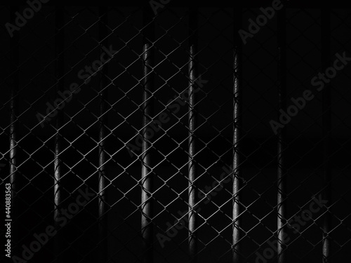 Fotografia wire mesh of cage with light and shadow, black and white style