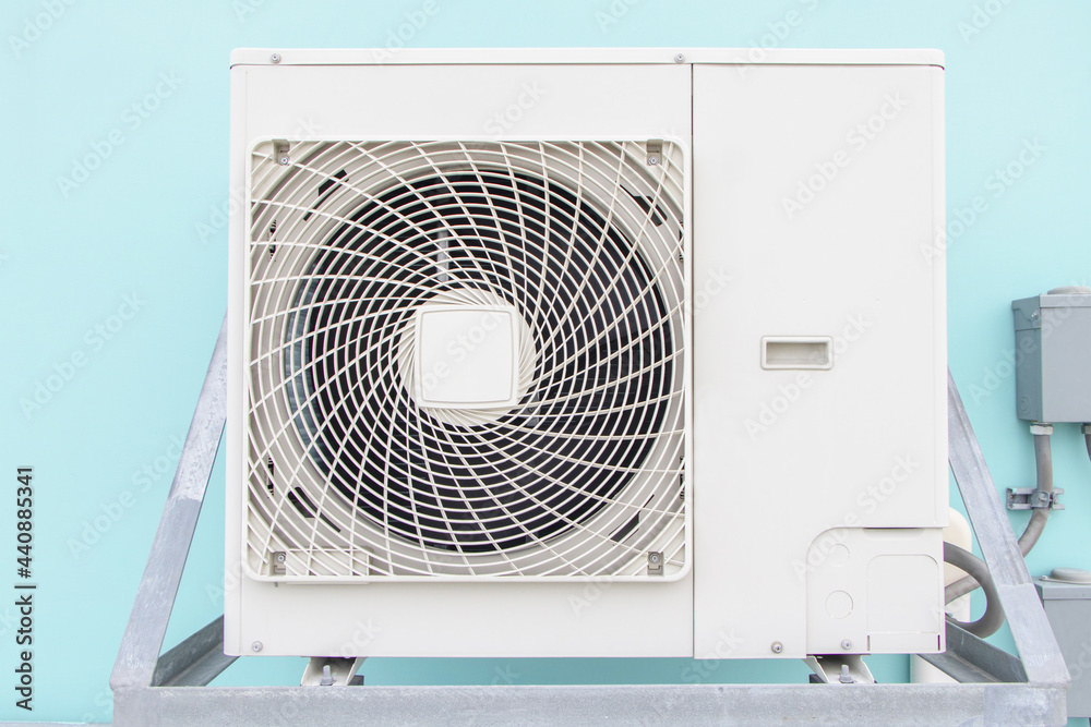 Big air conditioner compressor source heat pumps on wall outdoor on roof top of the building for cooling at industrial plant. Cooling pump technology for home or office. Suitable for hot weather. Big air conditioner compressor source heat pumps on wall outdoor on roof top of the building for cooling at industrial plant. Cooling pump technology for home or office. Suitable for hot weather.