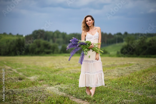 Girl with a bouquet of blue flowers