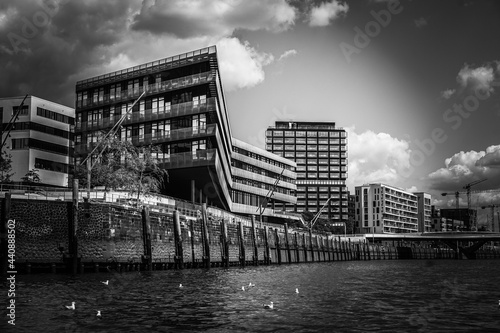 Vertical shot of the HafenCity University in Hamburg with the canals below it on a bright day photo