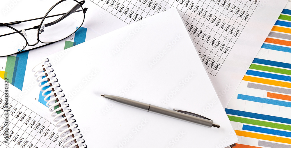 Notebook on graphs and charts. Top view with copy space. Business concept Notebook on graphs and charts. Top view with copy space. Business concept