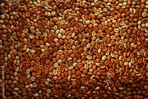 Mixture of raw and roasted coffee beans texture