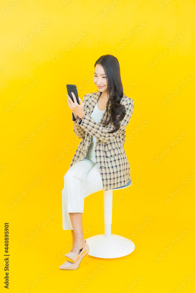 Portrait beautiful young asian woman smile with smart mobile phone Portrait beautiful young asian woman smile with smart mobile phone