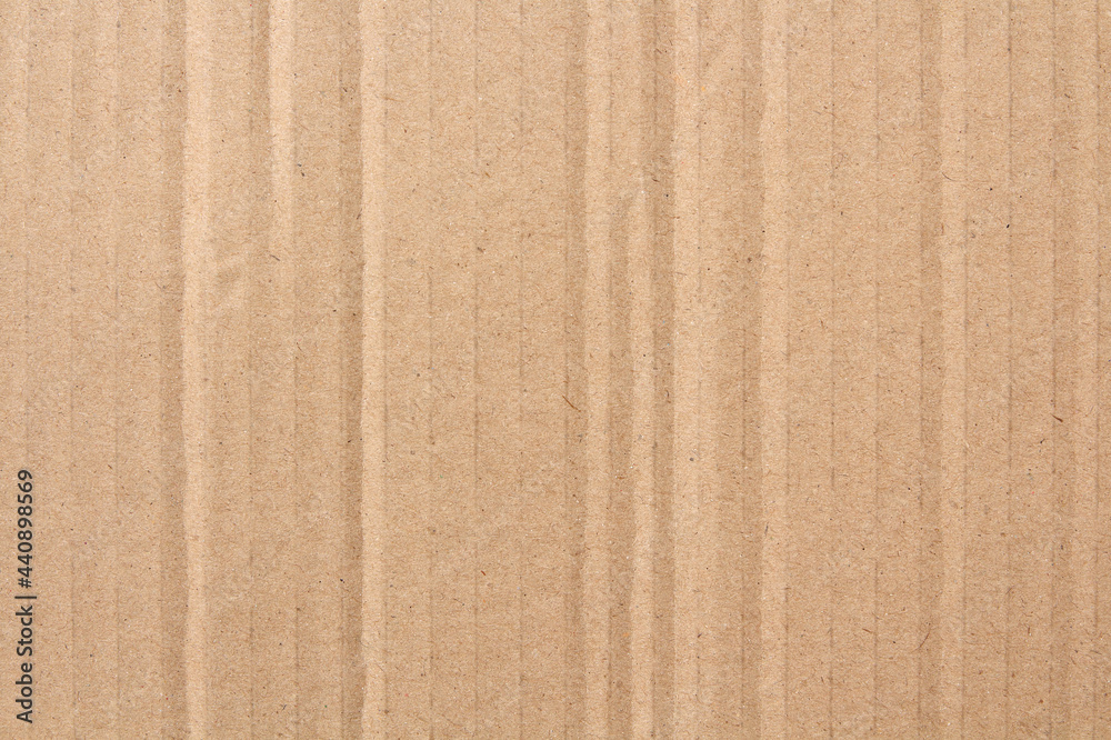 Fototapeta premium Cardboard sheet texture background, detail of recycle brown paper box pattern.