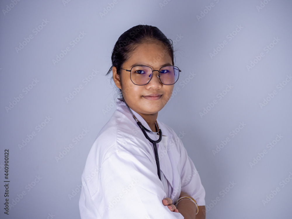 Portrait of a female doctor wearing glasses Standing with arms crossed on a white background. Portrait of a female doctor wearing glasses Standing with arms crossed on a white background.