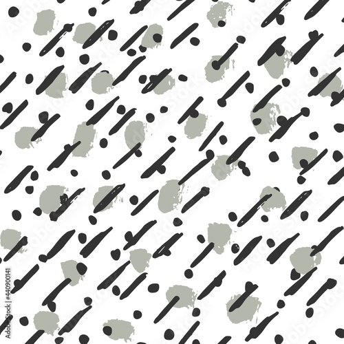Gray dots and black doodles on white background