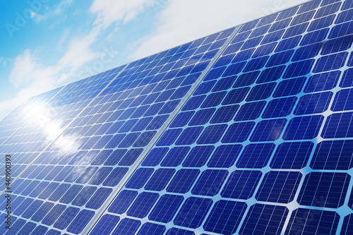 Solar panels power plant on a background of blue sky. 3d render.