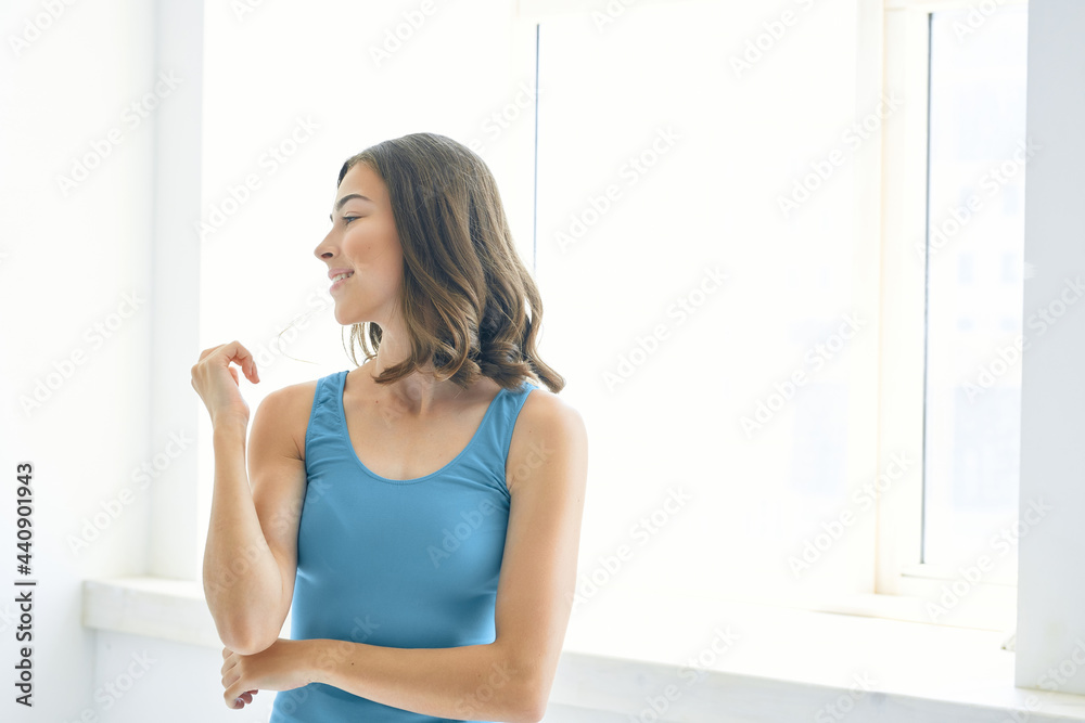 attractive brunette fashion hairstyle blue tank top posing lifestyle attractive brunette fashion hairstyle blue tank top posing lifestyle