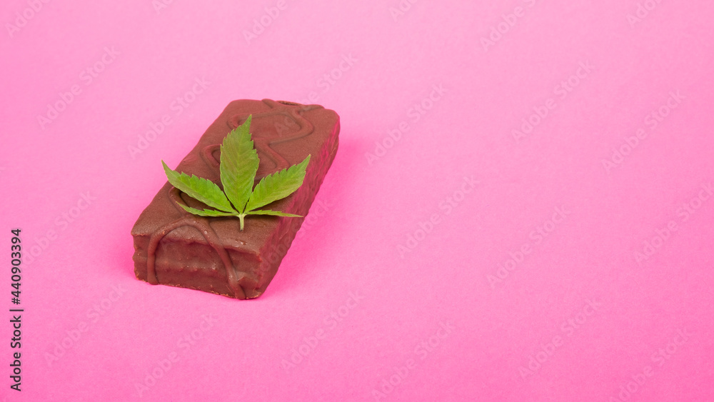 cannabis sweet food candy on pink background with copy space. cannabis sweet food candy on pink background with copy space.