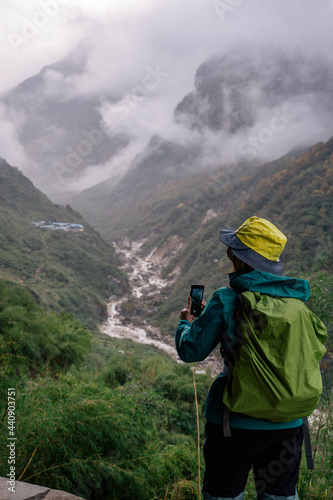 The woman trekking on the way to Annapurna base camp.