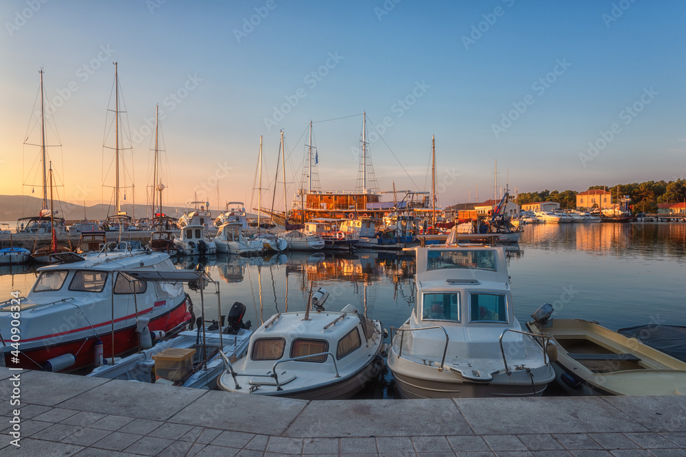 Scenic view of the harbor in Krka town with yachts in morning light, Krk island, Kvarner bay, Croatia. Popular tourist destination at Adriatic seacoast, outdoor travel background